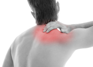 Man is touching his back because it aches
